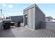 Enjoy the rooftop deck featuring stylish outdoor seating, a cozy fire pit, and ample space for entertaining at 1733 Irving St # 101, Denver, CO 80204