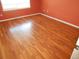 Bedroom with wood flooring and orange walls at 11226 Rodeo Cir, Parker, CO 80138