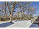 Large backyard with mature trees and snow cover at 355 S 38Th St, Boulder, CO 80305