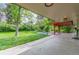 Lush backyard with covered patio and a well-maintained lawn at 5890 W Quarles Dr, Littleton, CO 80128