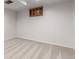 Neutral bedroom featuring carpet and paneled walls with overhead window at 5890 W Quarles Dr, Littleton, CO 80128