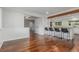 Open-concept area featuring bar seating and an adjacent dining area at 5890 W Quarles Dr, Littleton, CO 80128