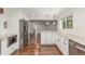Bright kitchen featuring stainless steel appliances and white cabinetry at 5890 W Quarles Dr, Littleton, CO 80128