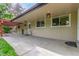 Covered patio with stained pergola, concrete, and stylish outdoor lighting at 5890 W Quarles Dr, Littleton, CO 80128