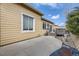 Home exterior showing a concrete patio area, and adjacent back deck at 10440 Olathe, Commerce City, CO 80022