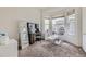 Sunlit bedroom with a sitting area by a bay window at 10440 Olathe, Commerce City, CO 80022