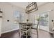 Bright dining area with a sliding glass door to the backyard deck at 10440 Olathe, Commerce City, CO 80022