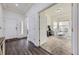 Bright foyer with dark wood floors leading to a comfortable living space at 10440 Olathe, Commerce City, CO 80022