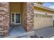 Close-up of the entryway featuring a stylish front door and brick accents at 10440 Olathe, Commerce City, CO 80022