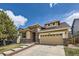 Inviting two-story home showcasing a brick and siding exterior with a two-car garage at 10440 Olathe, Commerce City, CO 80022