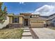 Charming two-story home with a well-manicured lawn and welcoming brick and siding exterior at 10440 Olathe, Commerce City, CO 80022