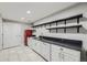 White kitchen with retro red fridge, stone countertops, and stylish shelving at 10440 Olathe, Commerce City, CO 80022