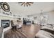 Open-concept living space featuring a fireplace, kitchen, and dining area at 10440 Olathe, Commerce City, CO 80022
