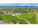 Scenic aerial view of the neighborhood park with walking paths, playground, and mountain backdrop at 10389 W Fair Ave # E, Littleton, CO 80127
