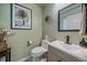 Inviting bathroom with elegant decorative accents and sleek fixtures, offering a stylish and comfortable space at 10389 W Fair Ave # E, Littleton, CO 80127