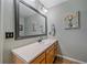 Practical bathroom featuring a large mirror, ample counter space, and storage cabinets, offering convenience and functionality at 10389 W Fair Ave # E, Littleton, CO 80127