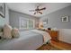 Serene bedroom with soft lighting and hardwood floors, offering a peaceful and comfortable retreat at 10389 W Fair Ave # E, Littleton, CO 80127