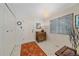 Welcoming entryway with tile floor, coat closet, and window for natural light at 10389 W Fair Ave # E, Littleton, CO 80127