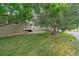 Beautiful exterior view of a home surrounded by mature trees and landscaping, enhancing its curb appeal and natural charm at 10389 W Fair Ave # E, Littleton, CO 80127