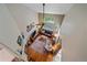 Aerial view of a warm living room with hardwood floors, comfortable seating, and lots of natural light at 10389 W Fair Ave # E, Littleton, CO 80127