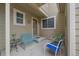 Charming front patio with comfortable seating and decor, creating a welcoming outdoor space at 10389 W Fair Ave # E, Littleton, CO 80127