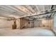 Unfinished basement featuring concrete floors and exposed ceiling beams, offering potential for customization at 14160 Bunny Hop Ln, Parker, CO 80134