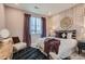 Bedroom with decorative wall hangings, patterned carpet, and decorative lamps at 14160 Bunny Hop Ln, Parker, CO 80134