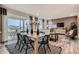 A stylish dining room with a large table, sliding glass doors, and contemporary decor at 14160 Bunny Hop Ln, Parker, CO 80134