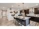 Modern kitchen with stainless steel appliances, a large island, and stylish pendant lighting at 14160 Bunny Hop Ln, Parker, CO 80134