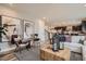 Inviting living room with a neutral color palette, comfortable seating, and an open view into the kitchen at 14160 Bunny Hop Ln, Parker, CO 80134