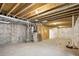 Spacious unfinished basement area with visible ceiling beams and ample room at 4101 S Lincoln St, Englewood, CO 80113