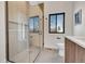 Bathroom featuring a glass enclosed shower, a vanity, and a toilet at 4101 S Lincoln St, Englewood, CO 80113