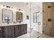 Modern bathroom featuring a double vanity, glass shower and tile flooring at 4101 S Lincoln St, Englewood, CO 80113