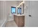 Modern bathroom featuring double vanity with sleek countertops and stylish fixtures at 4101 S Lincoln St, Englewood, CO 80113