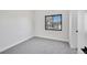 Bedroom with a ceiling fan, carpet, and a bright view from a modern window at 4101 S Lincoln St, Englewood, CO 80113