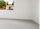 Bright bedroom with white walls, carpet floors, and a window at 4101 S Lincoln St, Englewood, CO 80113