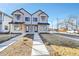 Charming two-story townhome with modern design elements and inviting front yard at 4101 S Lincoln St, Englewood, CO 80113