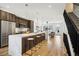 Contemporary kitchen featuring a large marble island, stainless steel appliances and barstool seating at 4101 S Lincoln St, Englewood, CO 80113