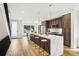 Open layout showing the kitchen island and modern finishes throughout with barstool seating at 4101 S Lincoln St, Englewood, CO 80113