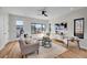 Comfortable living room with contemporary furnishings, a large window, and hardwood floors at 4101 S Lincoln St, Englewood, CO 80113