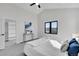 Vaulted ceiling bedroom with a ceiling fan, carpet, and a bright view from a modern window at 4101 S Lincoln St, Englewood, CO 80113