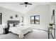 Serene main bedroom featuring a ceiling fan, neutral decor, and plenty of natural light at 4101 S Lincoln St, Englewood, CO 80113