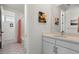 Elegant bathroom featuring a vanity with modern fixtures, decorative floor tiles, and updated hardware at 455 Rogers Way, Castle Rock, CO 80104