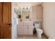 Neutral-toned bathroom features vanity with cabinet storage and frameless mirror at 1764 Mesa Ridge Ln, Castle Rock, CO 80108