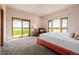 Bedroom boasts expansive windows with scenic views, a cozy chair, and access to the outdoors at 1764 Mesa Ridge Ln, Castle Rock, CO 80108