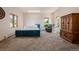 Bright bedroom with plush carpeting, natural lighting, and seating area near sun-filled windows at 1764 Mesa Ridge Ln, Castle Rock, CO 80108