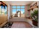 Bright foyer features a large window, arched seating, and charming decor, enhancing the home's welcoming ambiance at 1764 Mesa Ridge Ln, Castle Rock, CO 80108