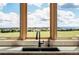 Close-up shot of a kitchen sink in front of a window with stunning panoramic views at 1764 Mesa Ridge Ln, Castle Rock, CO 80108