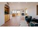 Spacious room with tile floors, a cozy fireplace, natural light, and comfortable seating at 1764 Mesa Ridge Ln, Castle Rock, CO 80108