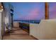 Relaxing outdoor deck with seating and stunning sunset views at 1764 Mesa Ridge Ln, Castle Rock, CO 80108